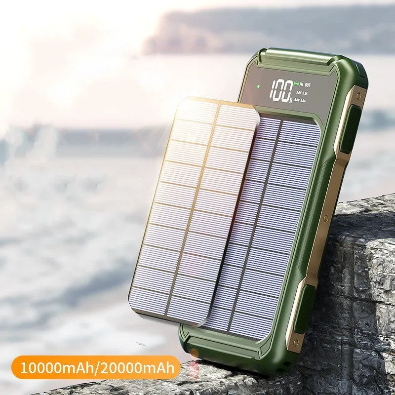Black military grade portable power bank showing size comparison with a mobile phone.