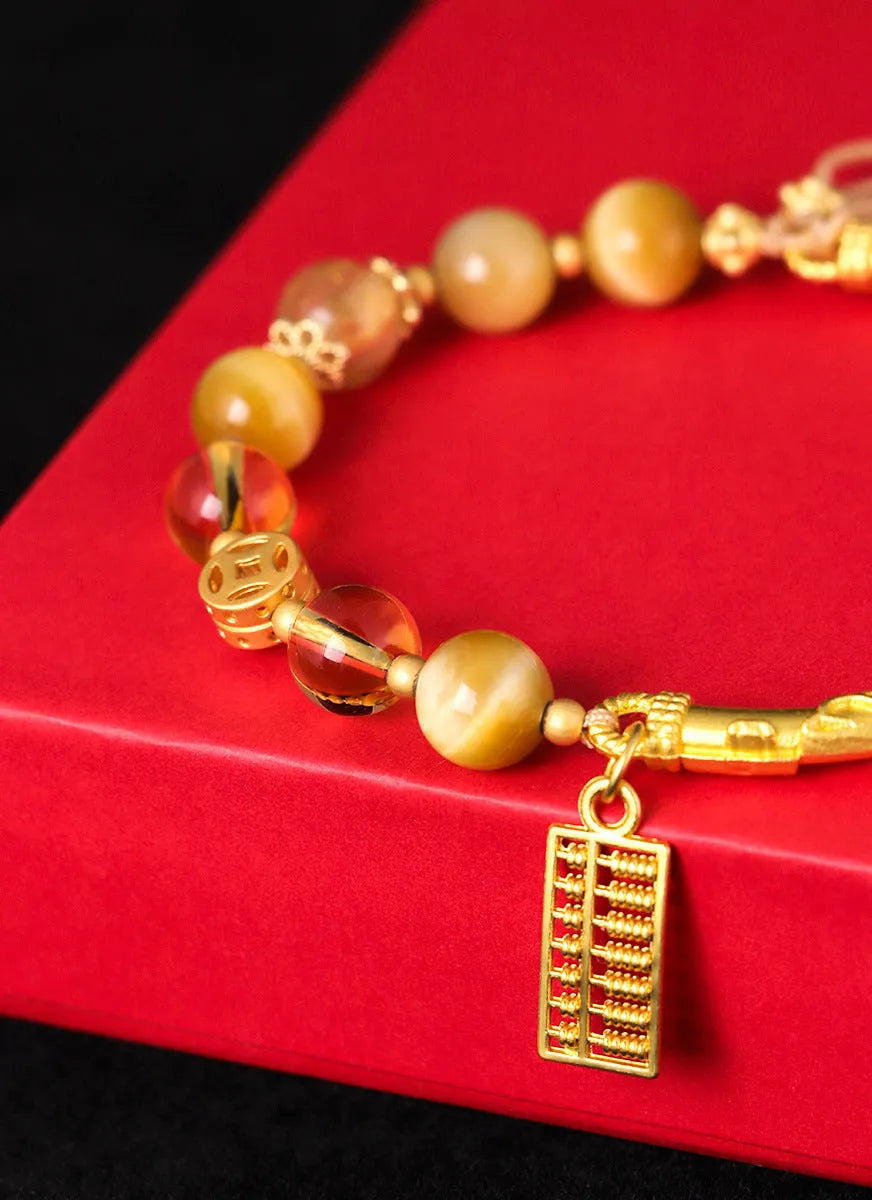 Women's tigereye and citrine abacus bracelet with diamond-shaped design and copper fastenings
