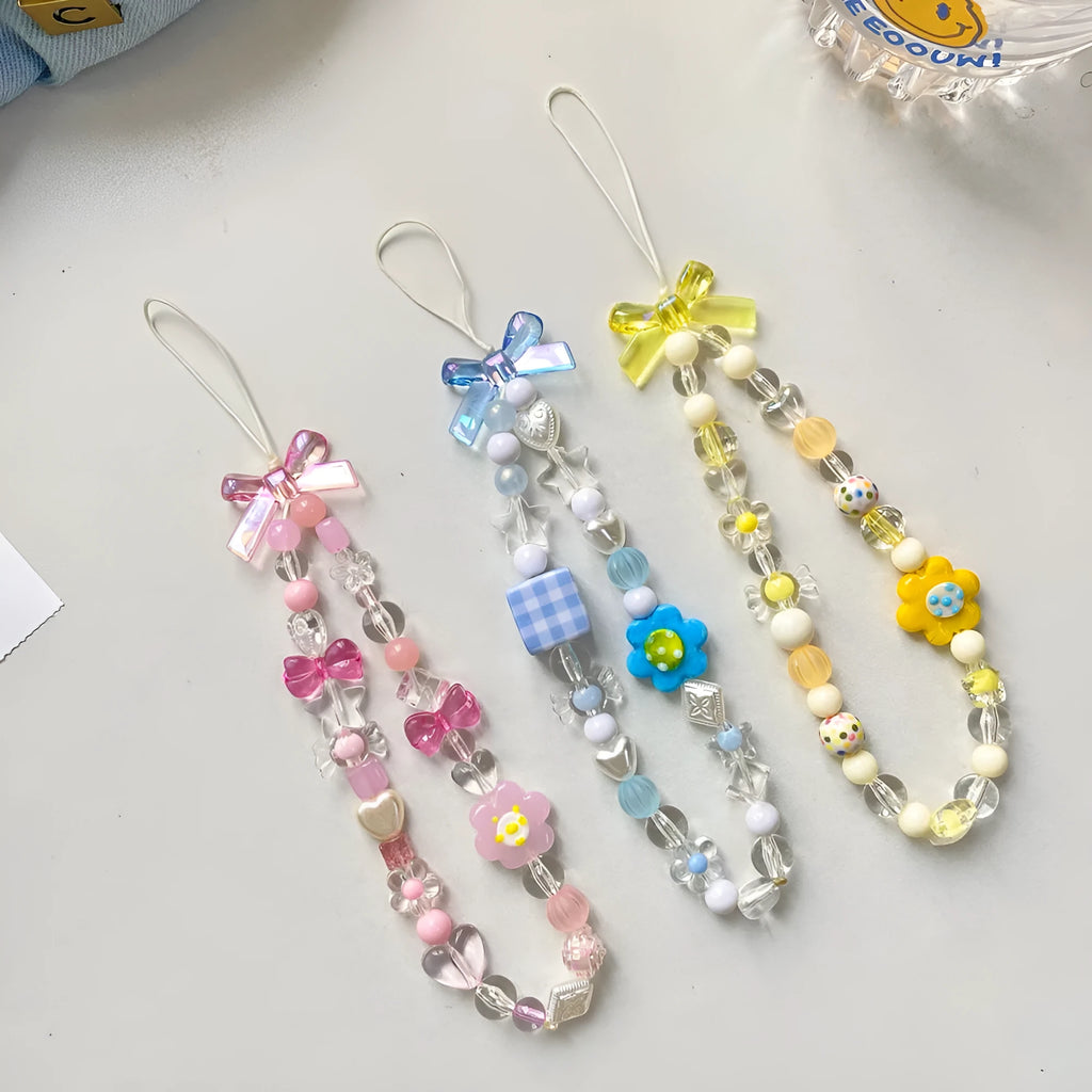 Beaded flower mobile phone lanyard in yellow, blue and pink colour options with plastic resin construction
