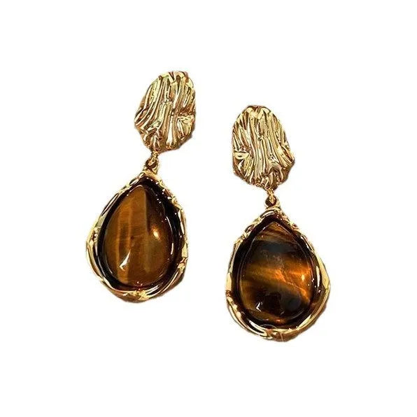 Handmade geometric alloy earrings with tassel details in three styles: round piece, irregular amber, and water drop tiger eye studs