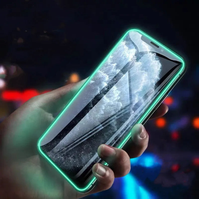 Luminous full cover tempered glass screen protector for iPhone glowing blue in the dark.