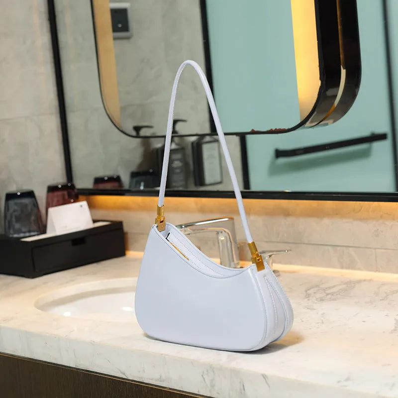 Oval retro commuter underarm handbag in PU leather available in seven colours with single shoulder strap