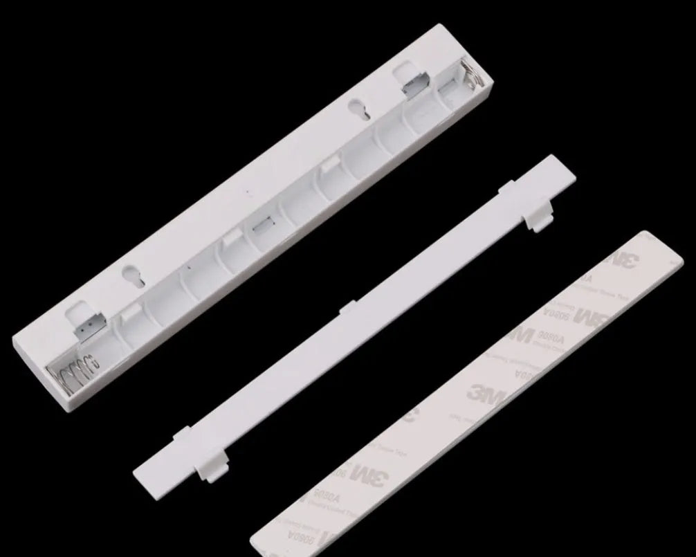 Silver aluminium LED closet light with motion sensor and magnetic back, shown illuminating a wardrobe.