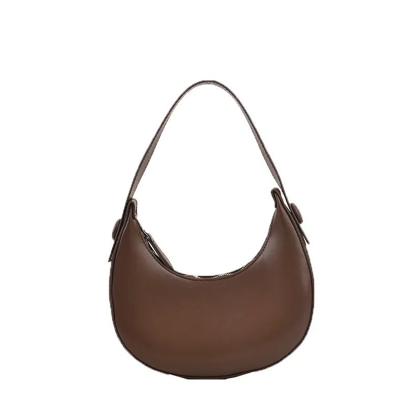 Women's retro dumpling-shaped shoulder bag in PU, shown in one of four colours, featuring an outer pocket and internal zipper compartment.