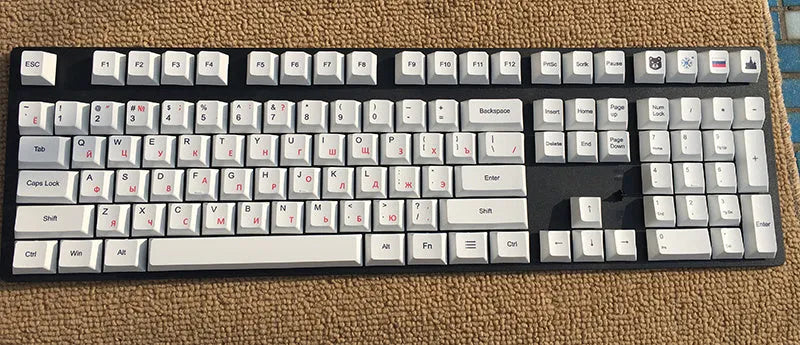 Set of PBT keyboard keycaps with Japanese, Russian, and Korean thermal sublimation legends, showing a five-sided spacebar.