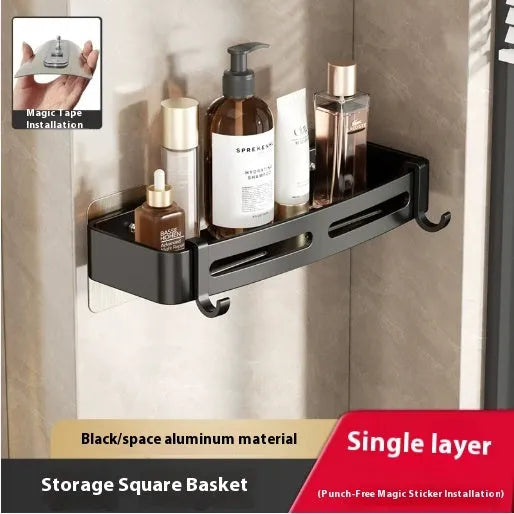 Gun grey metal triangle corner shelf mounted on a bathroom wall for shower storage.