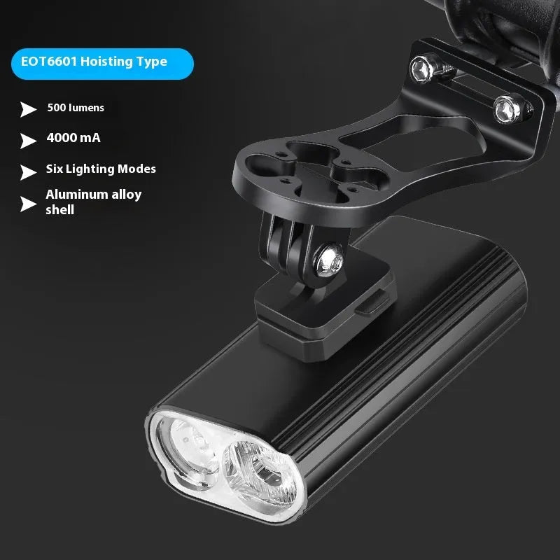 Aluminium alloy bicycle headlight with dual L2 lamps, USB Type-C charging port, and quick-release mounting base.