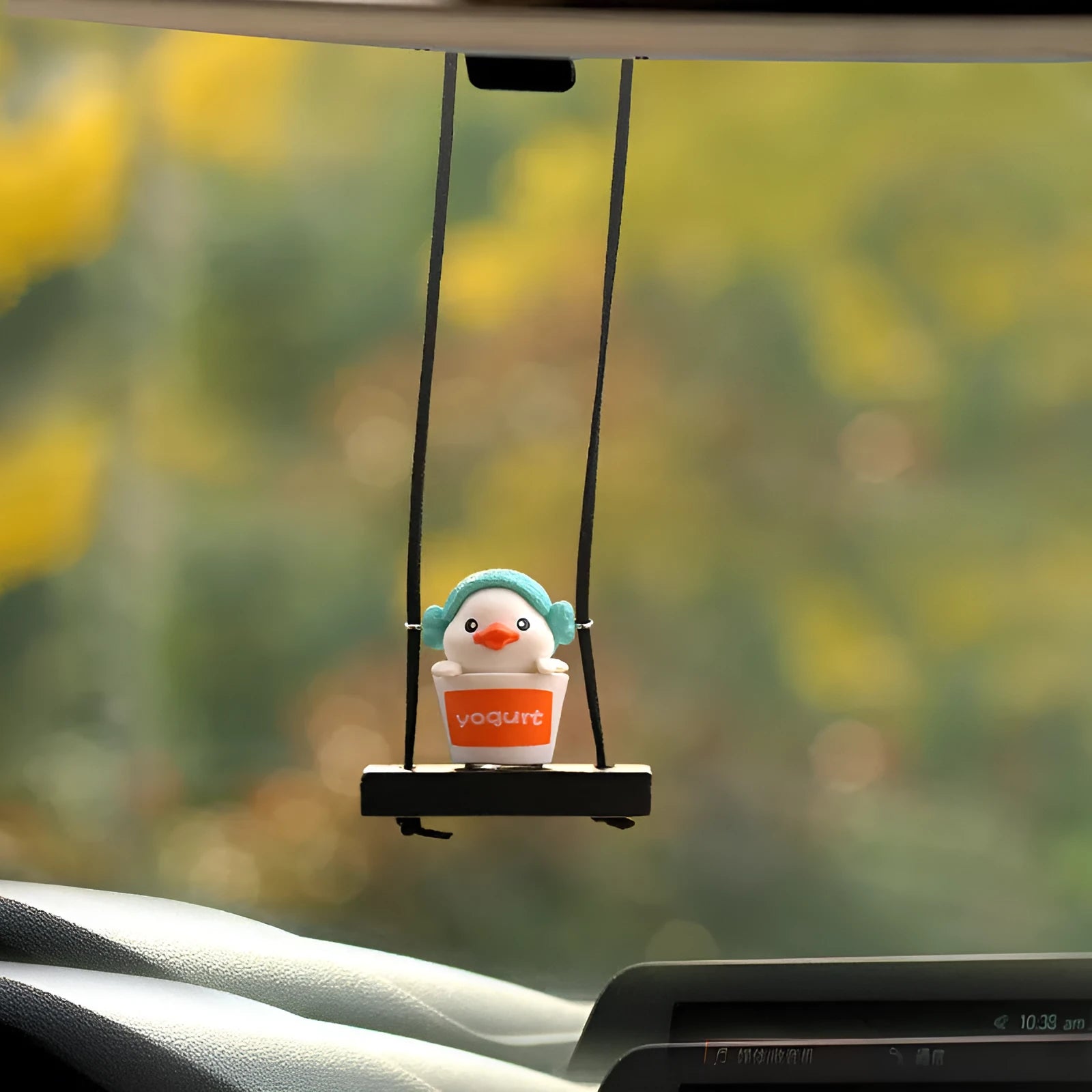 Yellow plastic duck doll car hanging ornament shown in four design variations.