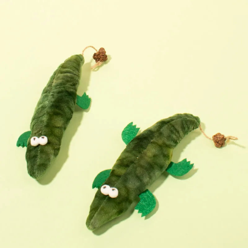 Green plush alligator catnip toy with plant-based materials and peppermint scent