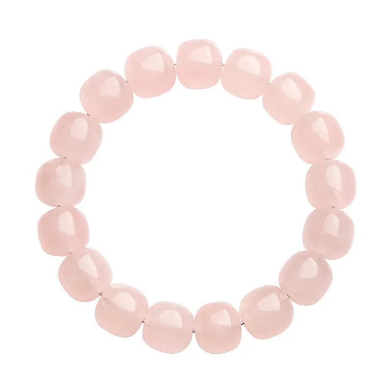 Natural pink crystal barrel bead bracelet with 11-12mm geometric design on wrist