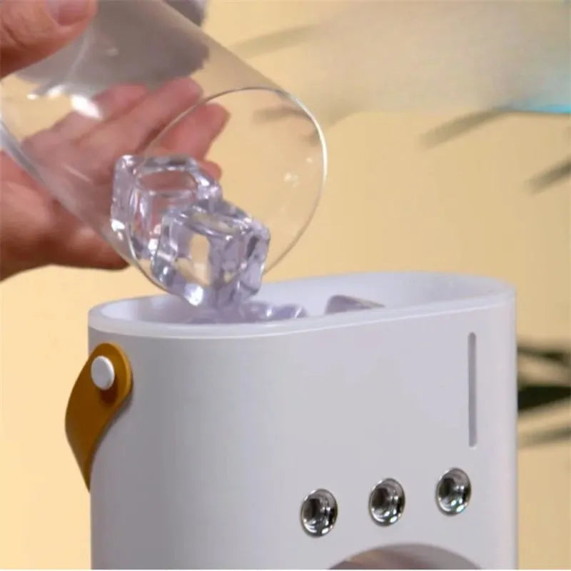 White portable humidifier fan with two spray heads, remote control, and coloured LED lights on a desk.