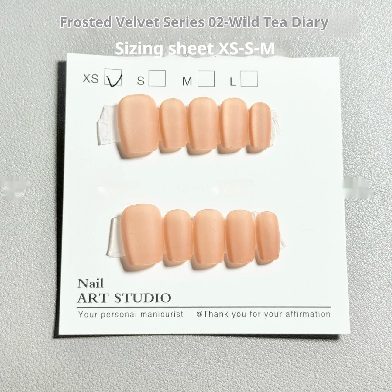 Velvet Frosted Cat's Eye false nail art set showing Aurora and solid colour designs on short ladder shaped nails.