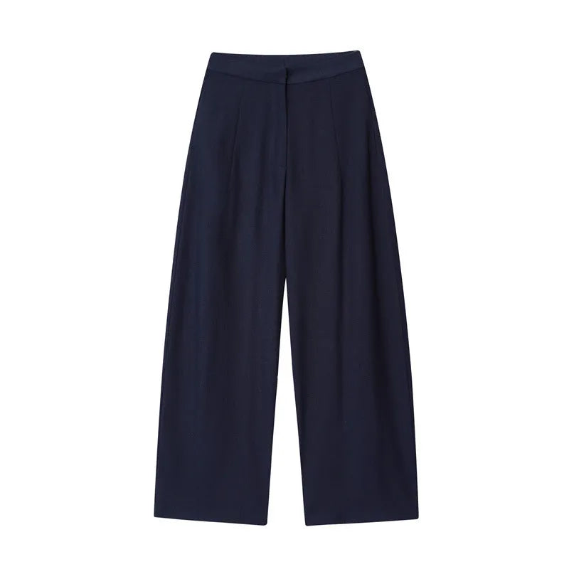 Women's linen blend co-ord set featuring a blouse with flounced sleeves and matching wide leg trousers.