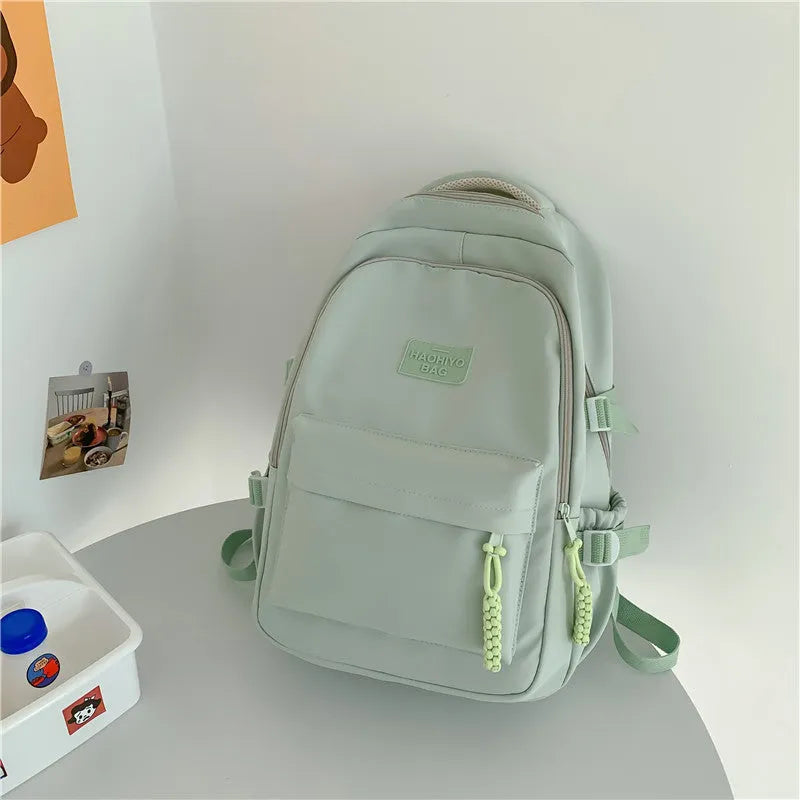 Korean-style lightweight waterproof nylon backpack for primary school students in macaron colour with curved shoulder strap, 20-35L capacity