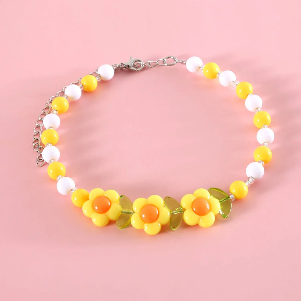 Colourful plastic bead cat necklace in small flower, rainbow or peach designs with adjustable sizing