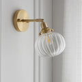 Pumpkin-shaped decorative glass wall lamp in water ripple, blue, or clear finish for living room or bedroom.