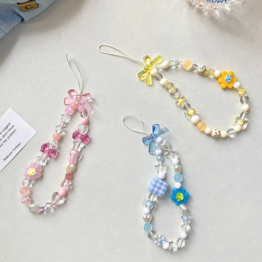 Beaded flower mobile phone lanyard in yellow, blue and pink colour options with plastic resin construction