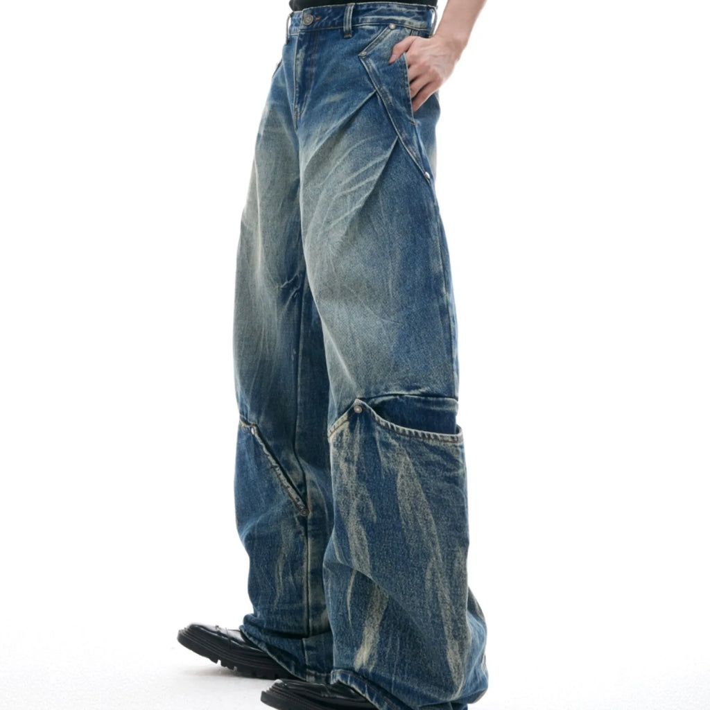 Men's verdant blue loose-fit jeans with a retro washed finish and curved knife style.