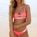 Women's bikini swimsuit in polyester fabric, showing dot and stripe colour options.