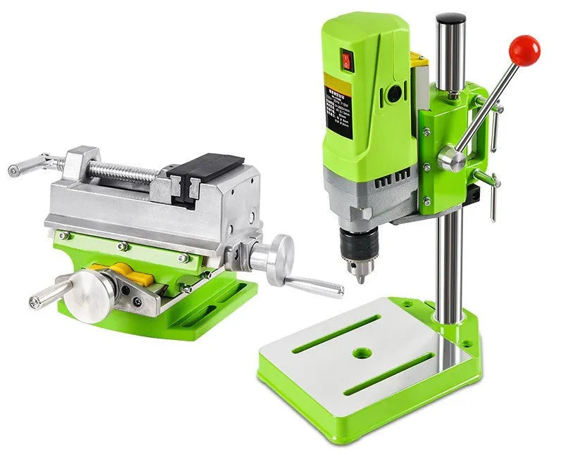 Bench-mounted drilling and milling machine with cross bench pliers and heavy-duty bench pliers.