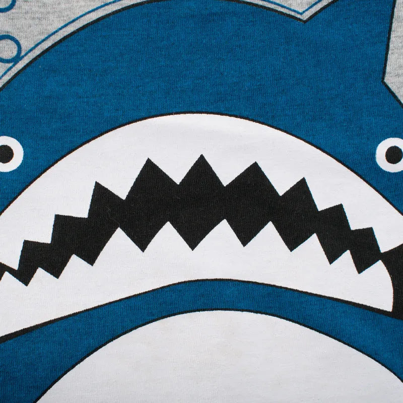 Grey children's cotton T-shirt laid flat, showing a size chart for measurements from 90cm to 140cm.