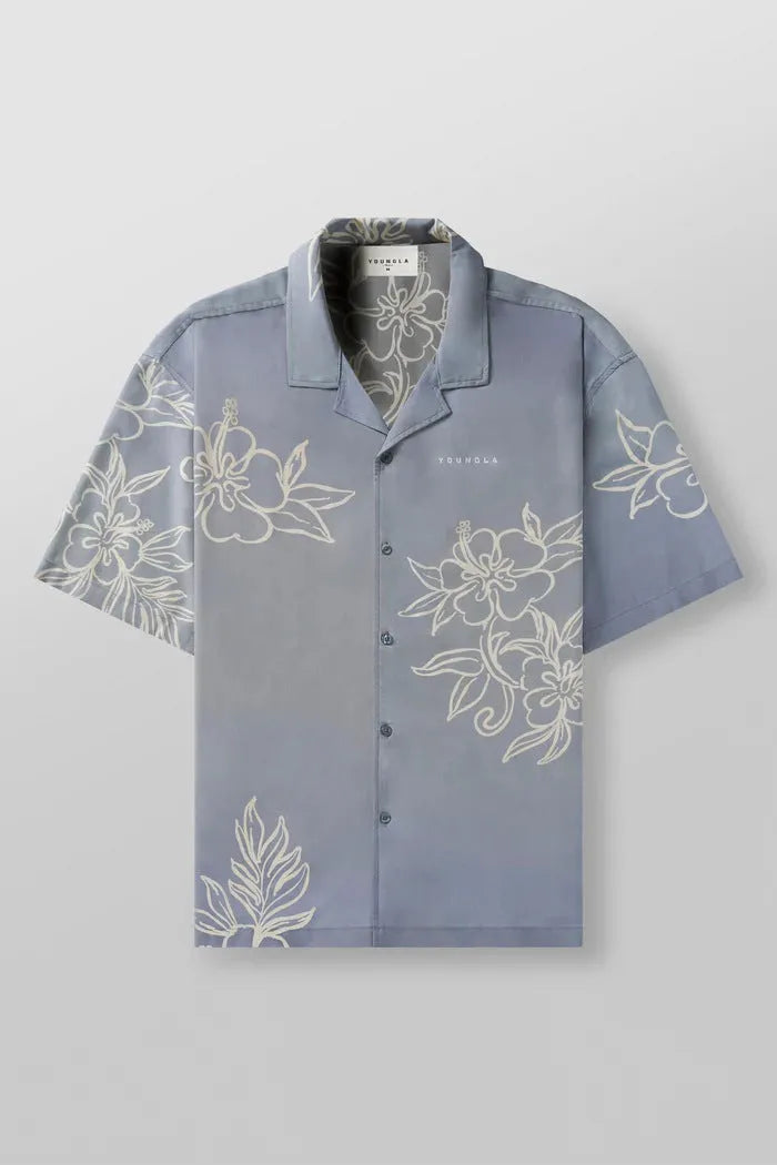 Man wearing a loose, short-sleeve floral print casual top in a cardigan style.