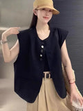 Women's loose fit polyester vest in milky white with a pocket detail and short 40cm length.