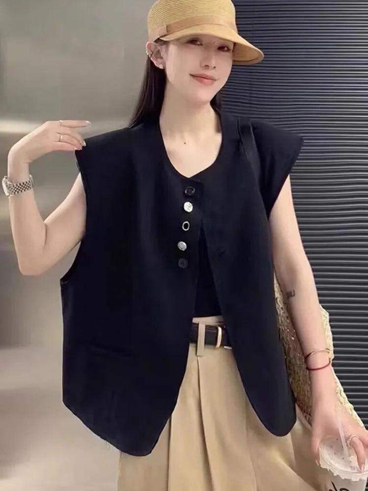 Women's loose fit polyester vest in milky white with a pocket detail and short 40cm length.