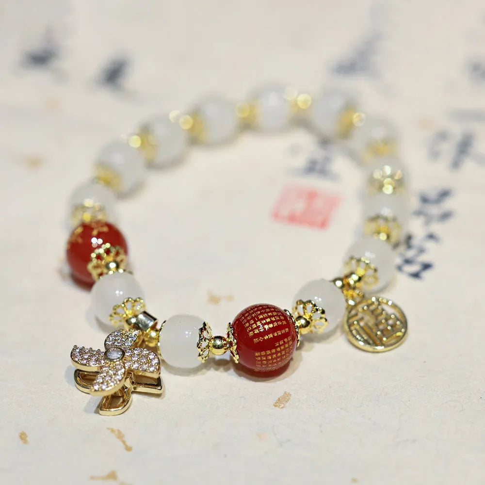Chinese style women's glass bracelet with fu character and safety lock charms.