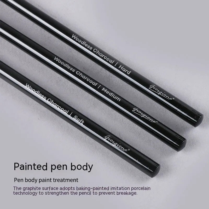 Set of six graphite and three carbonised drawing pencils on suction card packaging