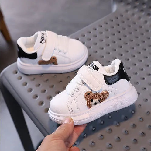 Children's black casual sports shoes with a cartoon bear design on the side, featuring an artificial leather upper and rubber sole.