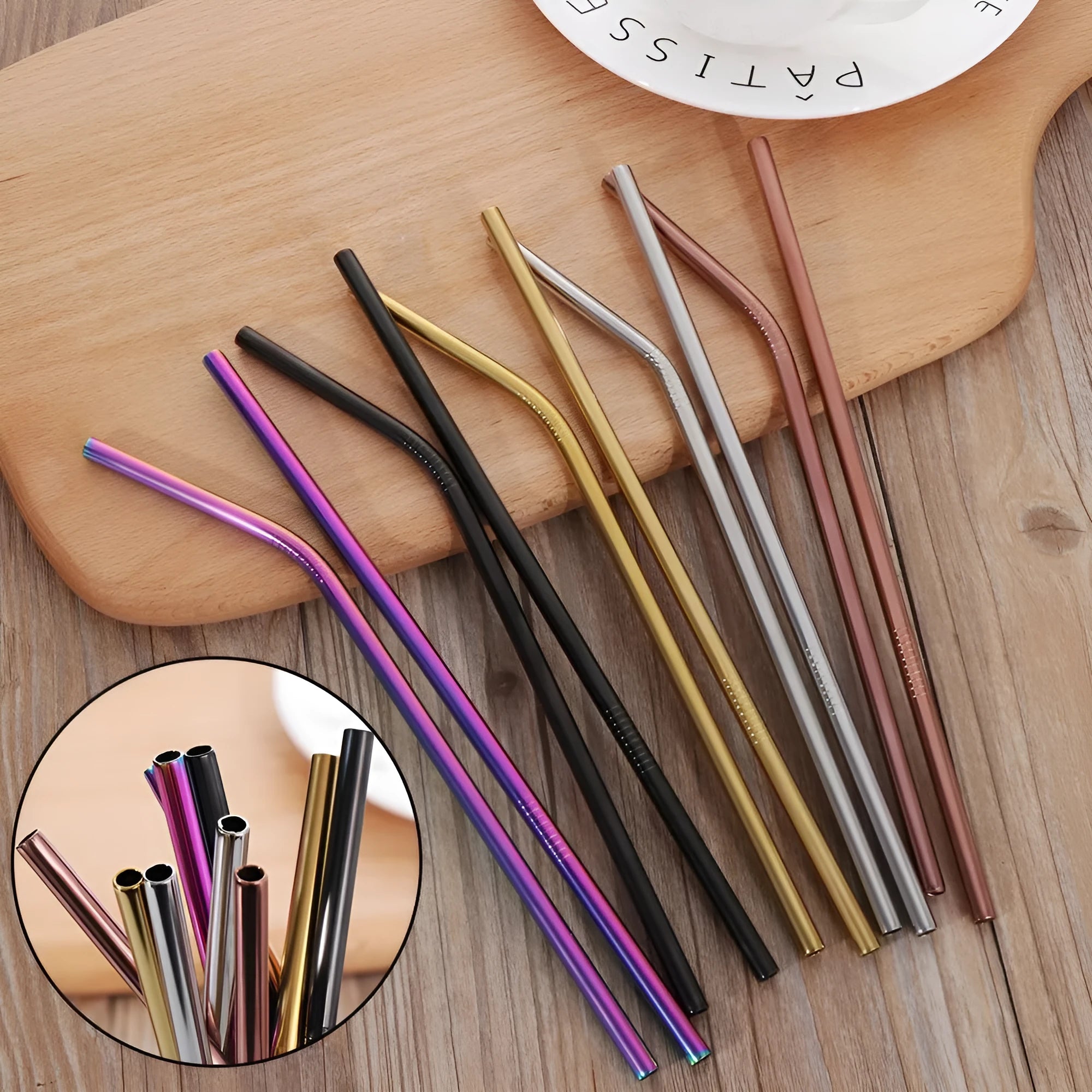 Set of colourful reusable stainless steel straws in straight and bent styles with a cleaning brush.