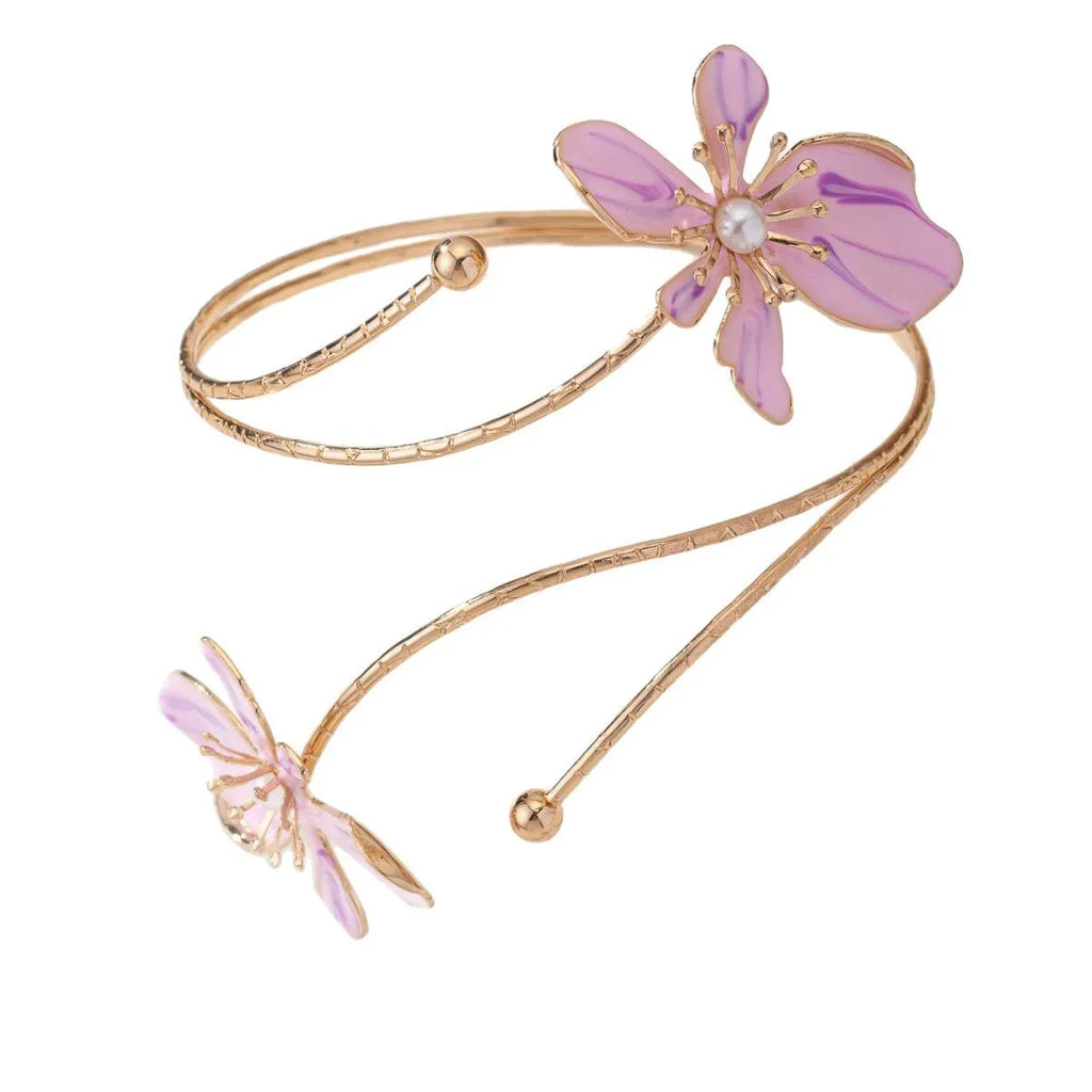 Close-up of a personalised pink alloy armband with a hollow line pattern.