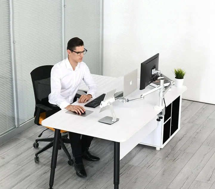 Silver foldable aluminium phone tablet stand with 360-degree rotating bracket on a desktop.