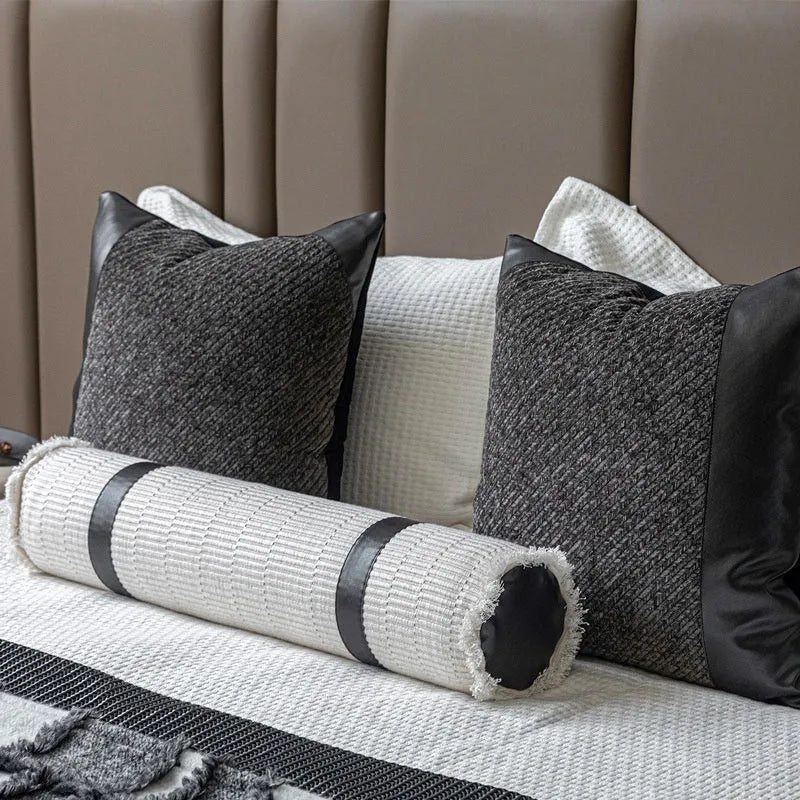 Modern grey and white plaid bed runner nap blanket set with pillow on a bed.