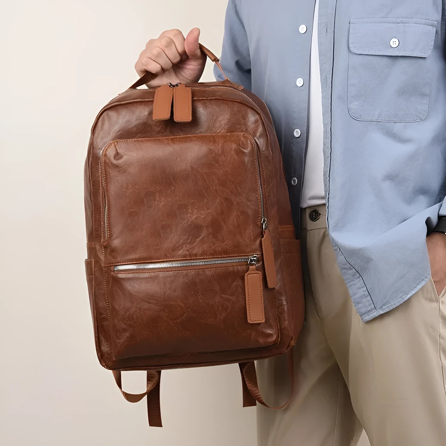 American Vintage large capacity waterproof backpack in solid colour with curved shoulder strap and sewing line detail
