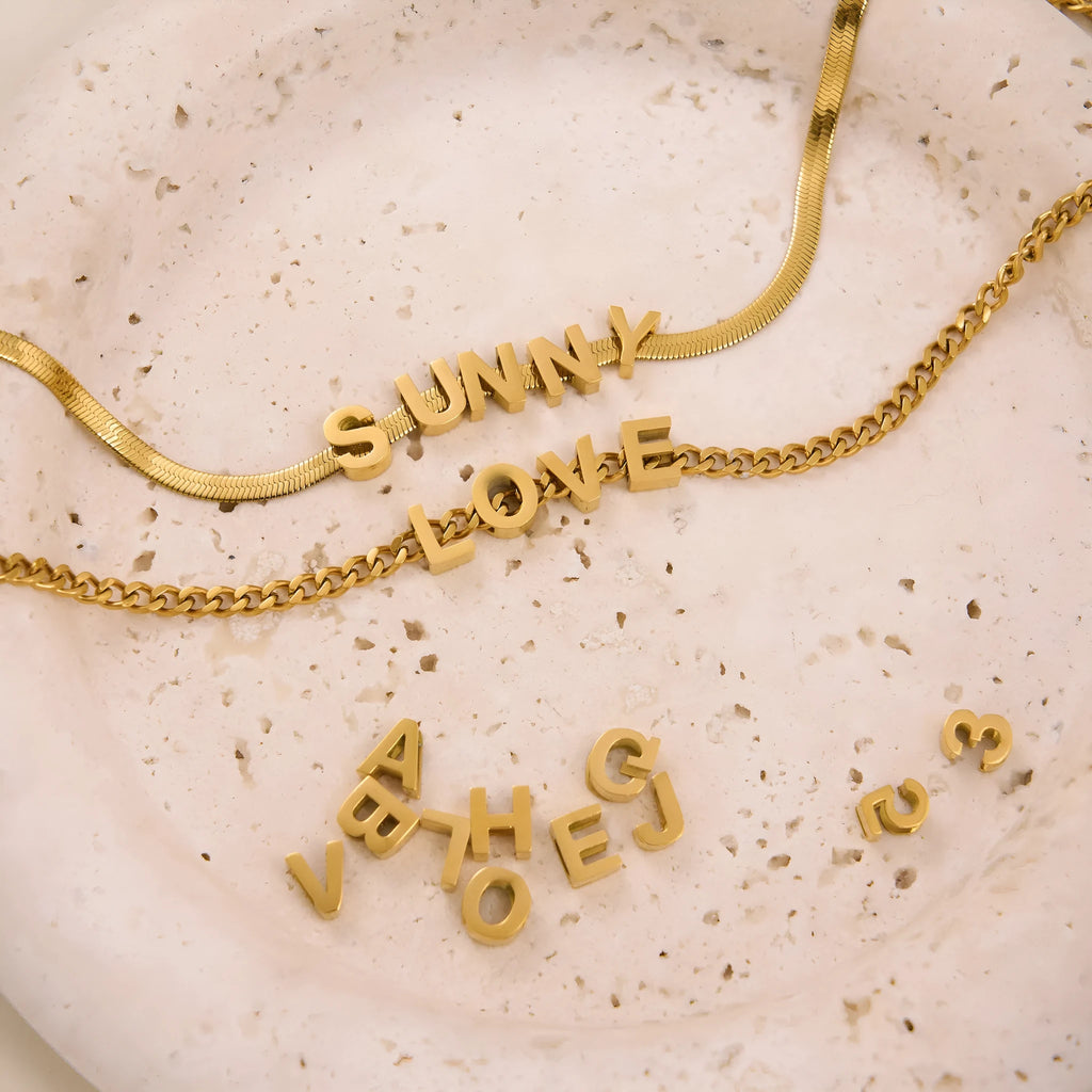 Gold electroplated titanium steel necklace with letter A pendant on a 40cm blade chain