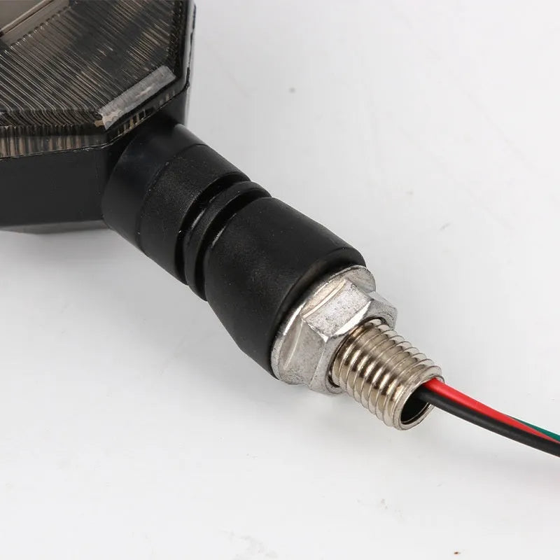 Arrow-shaped LED motorcycle direction indicator light with 12V yellow and coloured accent options.