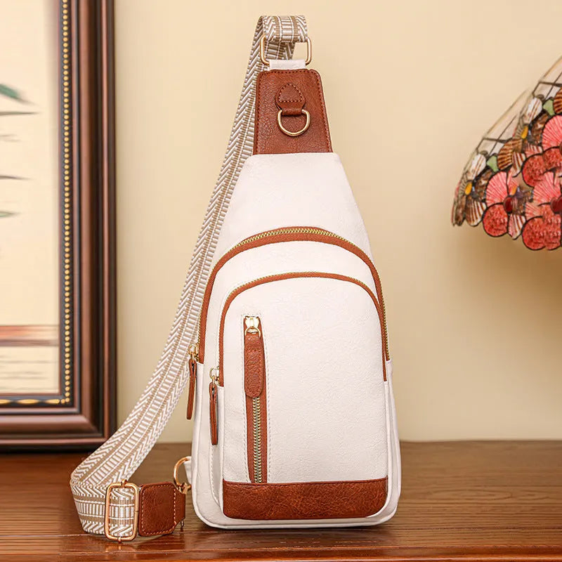 Soft brown PU leather women's crossbody chest bag with an open front pocket.