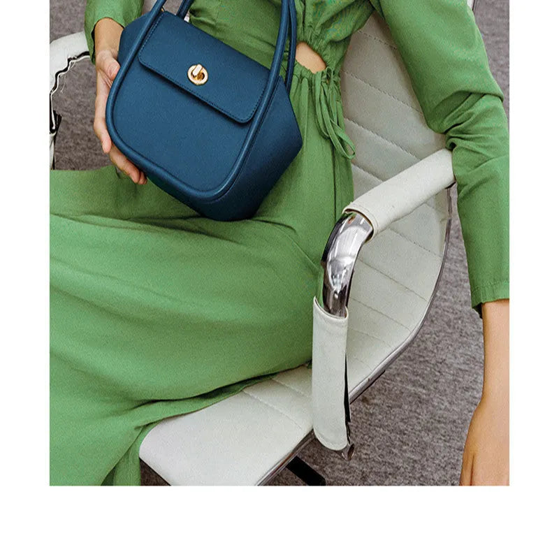 Women's cow leather wing tote bag with shoulder strap and latch closure in four colour options