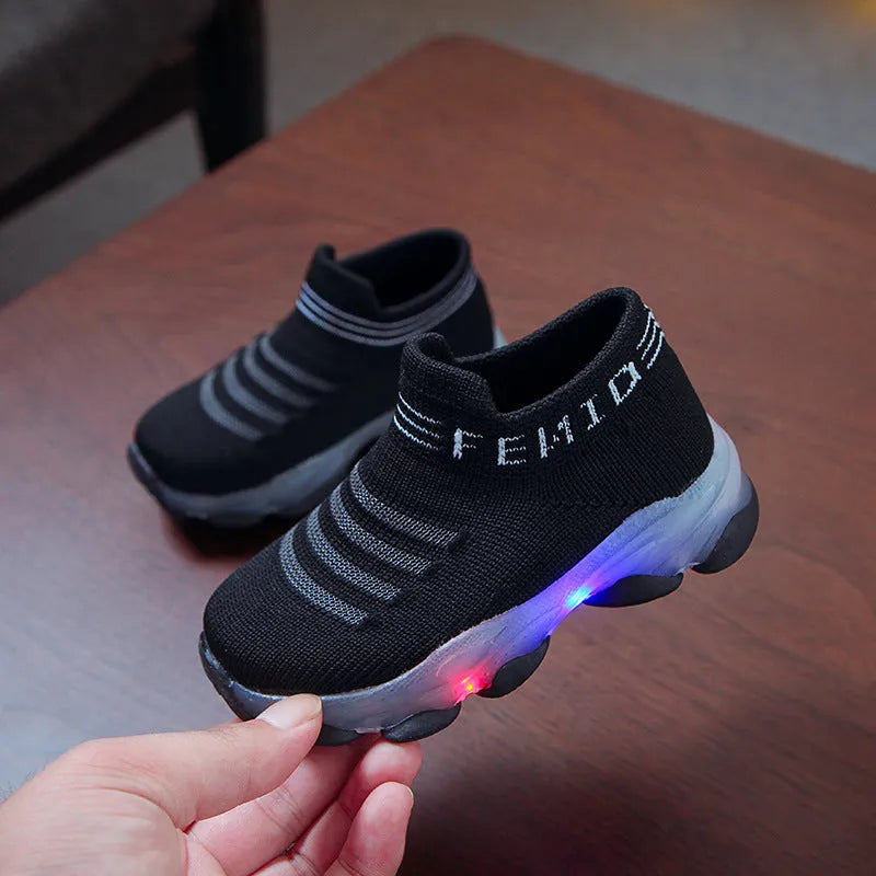 Flying woven sneaker overshoes in black with EVA sole, side view showing slip-on design