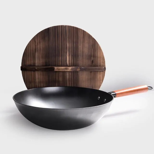 Black traditional iron wok with wooden handle measuring 32cm diameter with induction base