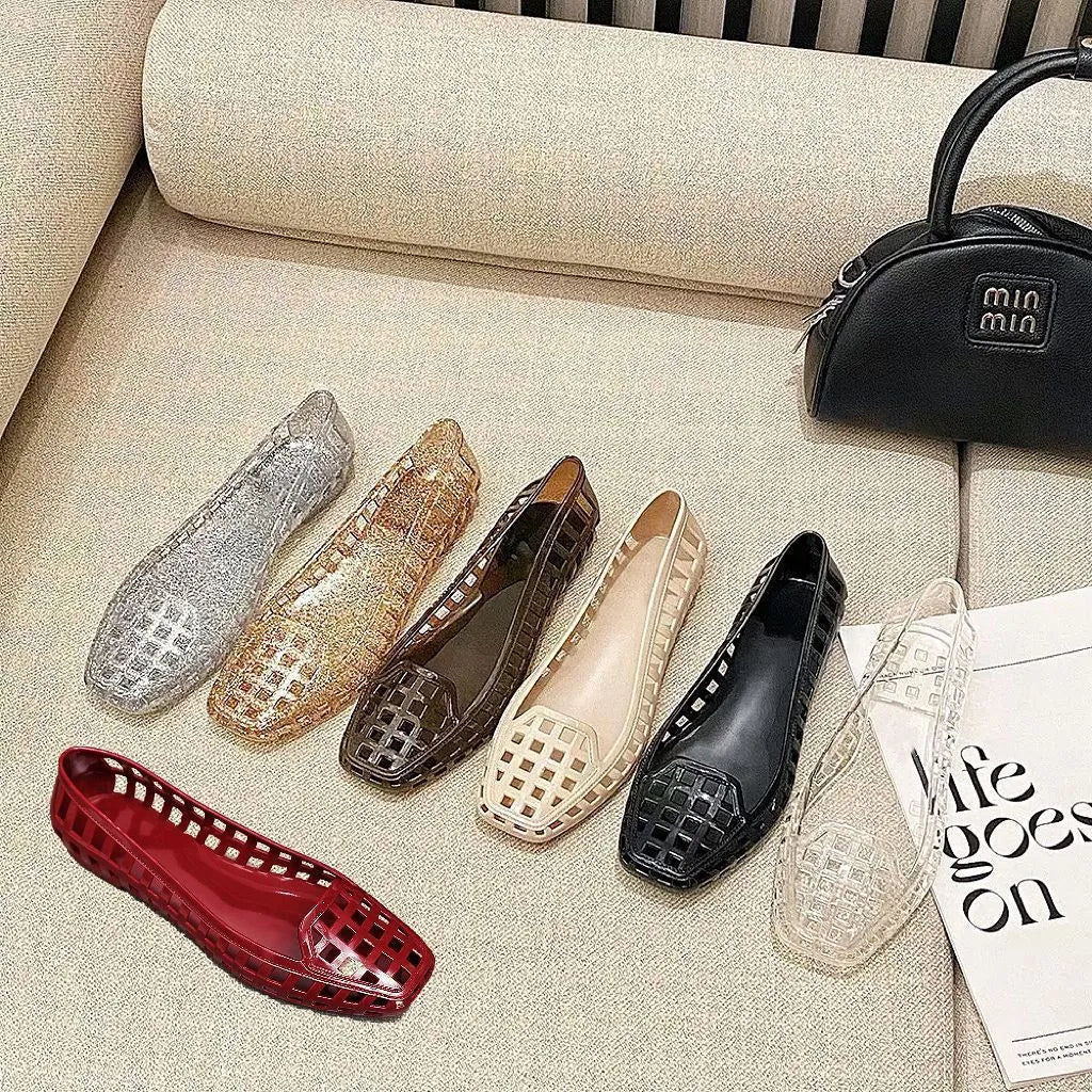 Women's transparent square toe PVC gel slipper on a neutral background, showing the distinctive toe shape.