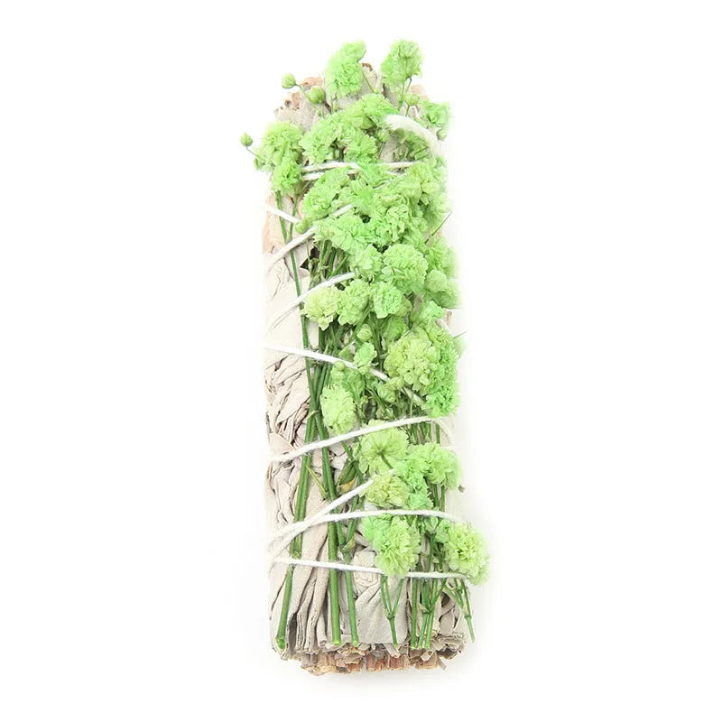 White sage and red rose petal colourful aromatherapy incense bundle on a wooden table