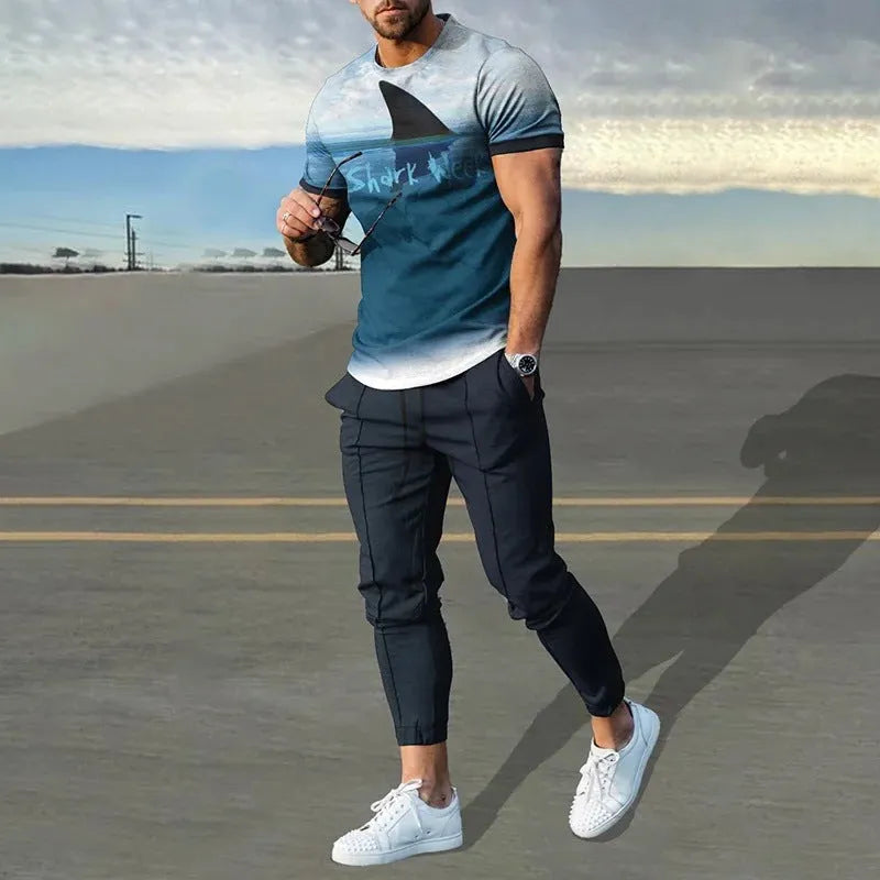 Man wearing a thin, short-sleeved printed pullover and matching trousers from a polyester blend sport suit set.