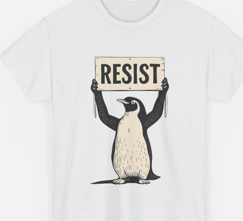 A loose-fitting black cotton T-shirt with short sleeves and a round neck on a hanger.