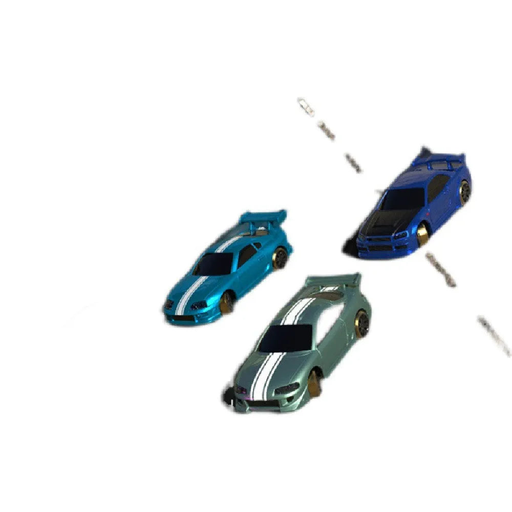 Turbo Racing 1:76 scale mini RC drift car with green body on drift track, remote control and storage box visible