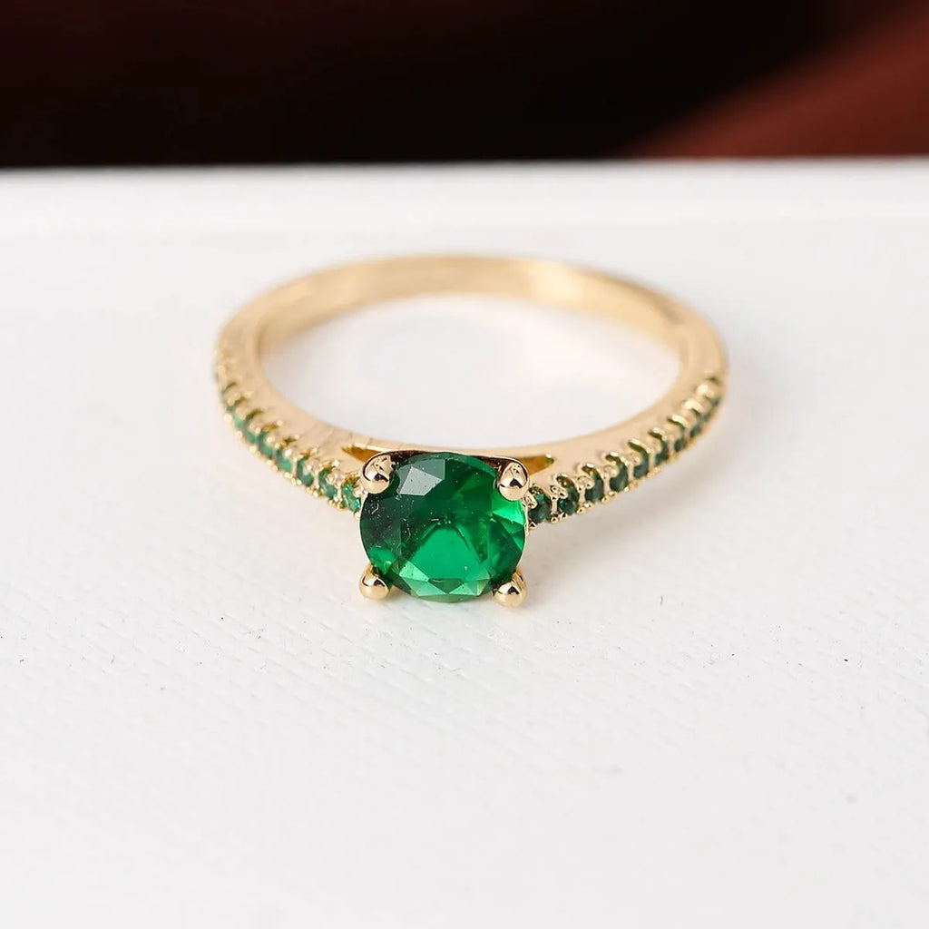 A geometric hexagonal zircon ring in a copper electroplated finish, shown in a gold rose red colour.