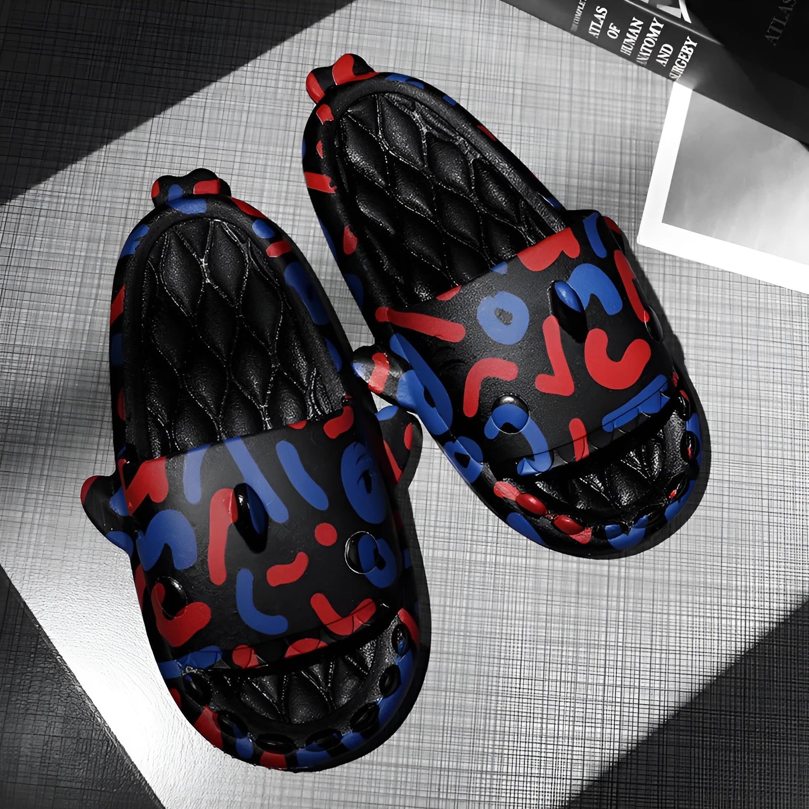 Shark-themed open-toe EVA slippers for couples in various colours on a white background.