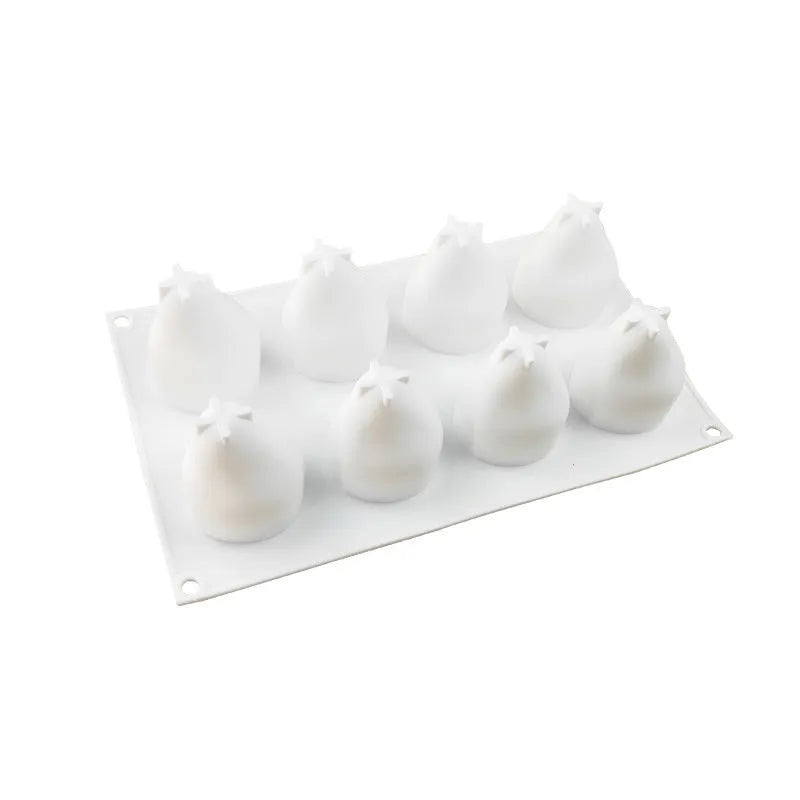 Silicone mould with six cavities shaped as pineapple, pine cone, and pear for baking desserts.